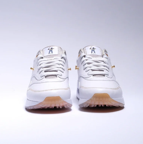 Nike White Low-Top Sneakers with Gold-Tone Details & Multicolor Outsole