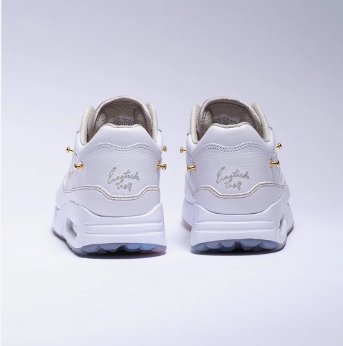 Nike White Low-Top Sneakers with Gold-Tone Details & Multicolor Outsole