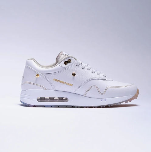Nike White Low-Top Sneakers with Gold-Tone Details & Multicolor Outsole