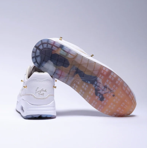 Nike White Low-Top Sneakers with Gold-Tone Details & Multicolor Outsole