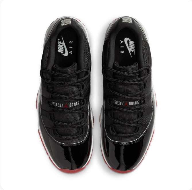 Air Jordan Black Low-Top Sneakers with Glossy Panels & Red Outsole