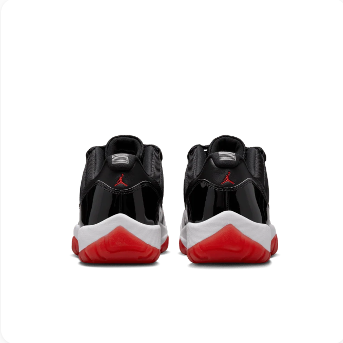 Air Jordan Black Low-Top Sneakers with Glossy Panels & Red Outsole